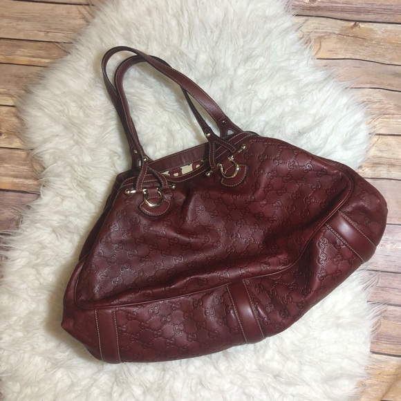 Gucci Handbags - Gucci maroon embossed leather monogram bag